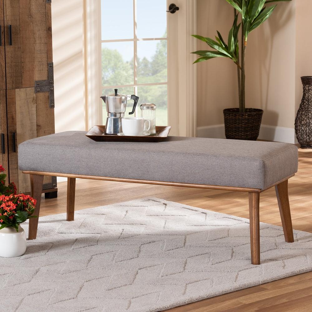 BAXTON STUDIO ODESSA MID-CENTURY MODERN GREY FABRIC UPHOLSTERED AND WALNUT BROWN FINISHED WOOD DINING BENCH